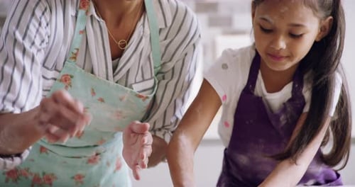 Girl and Woman Baking Cookies Together at Home