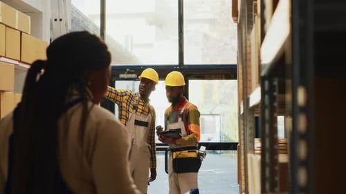 Team of Men Working on Stock Inventory in Warehouse