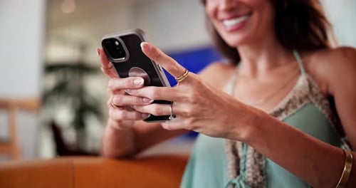 Woman Using Smartphone Indoors