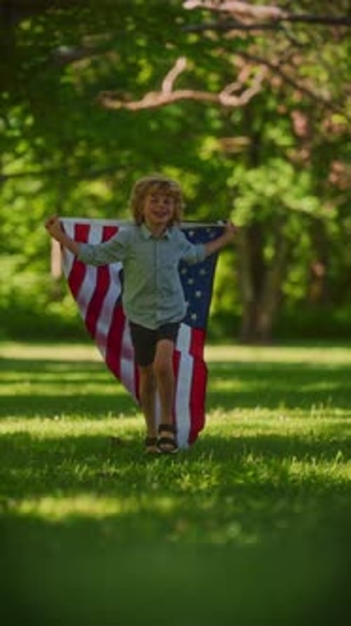 Child Running with American Flag in Sunny Park
