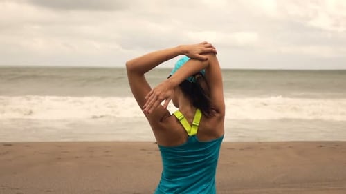 Sporty Woman Exercising, Stretching Arms On Beach, Super Slow Motion 240fps