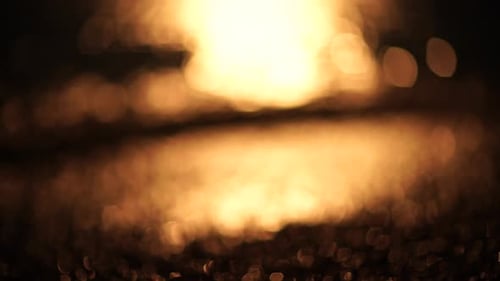 Blurred Golden Sea at Sunset The Sun Reflects and Sparkles on the Waves with Bokeh Illuminating the