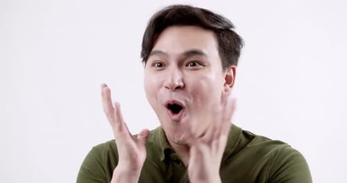 Exciting surprise reaction indoor studio portrait minimalistic close-up emotional expression