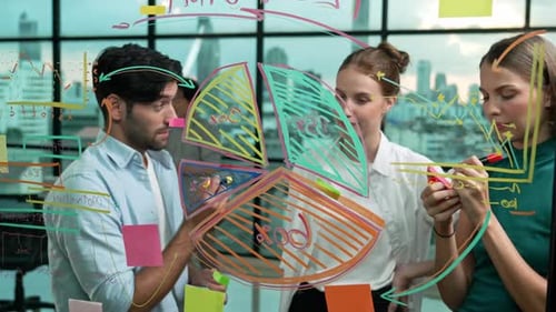 Business Team Brainstorming Ideas Together at Office Window