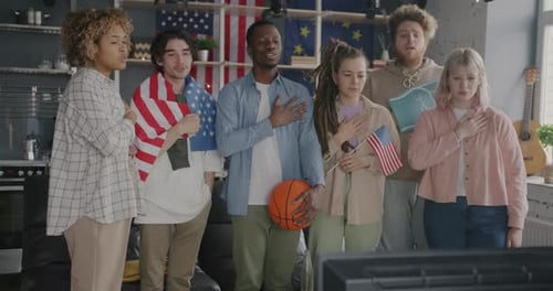 Friends Watching Television with American Flags