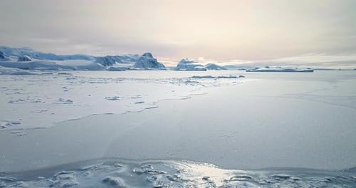 Fly Over Frozen Antarctic Ocean Sunset Landscape