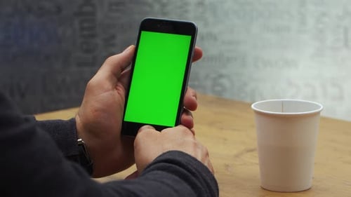Man Using Vertical Smartphone with Green Screen Closeup Shot of Man's Hands with Mobile Phone Chroma