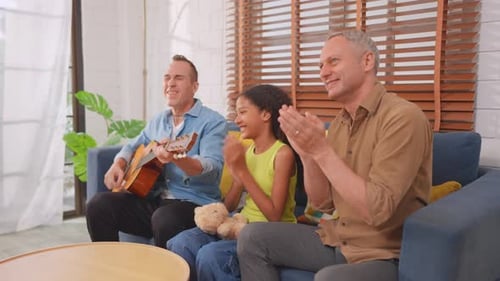 Family Enjoys Music Together At Home