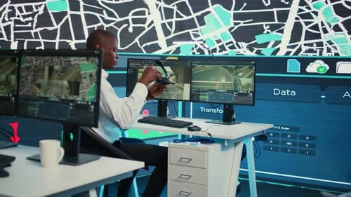 Tech Worker Monitors Data in Modern Office