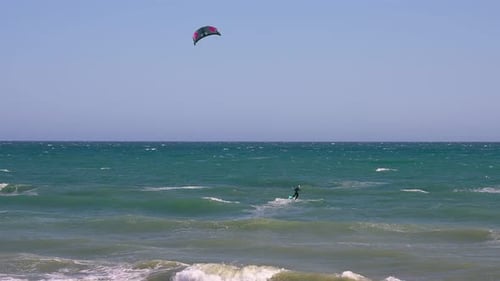 Man Kiteboarding in the ocean