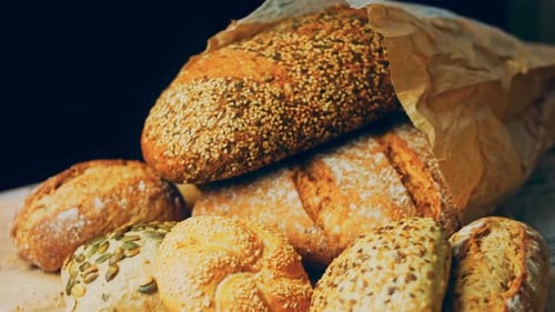 Assortment of Freshly Baked Bread Loaves and Rolls