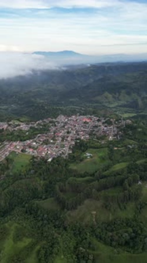 Aerial video over Salento towards a lush forested valley in the mountains of Colombia, Colombia
