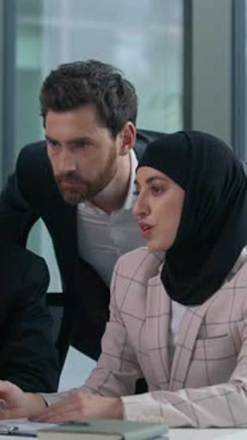 Multicultural Business Colleagues Collaborating in Modern Office Multiracial Coworkers Working