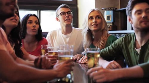 Friends Celebrating Victory at the Pub