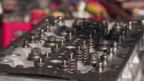 Mechanic Covers Valve Of Car Engine In Repair Shop