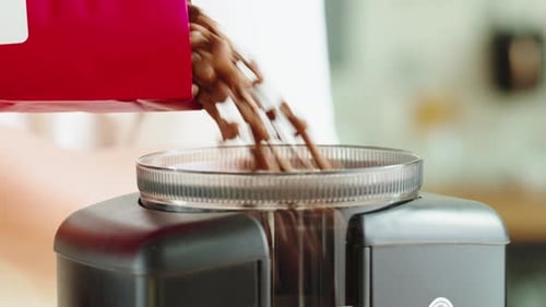 Electric Coffee Grinder Preparing to Grind Coffee in Shop Barista Making Specialty Drink