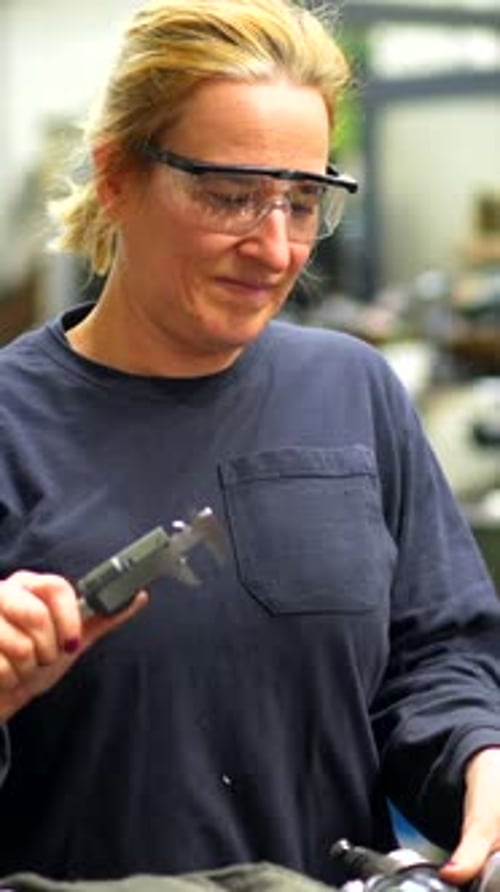Female Factory Worker Operator Working in Numerical Control Sector
