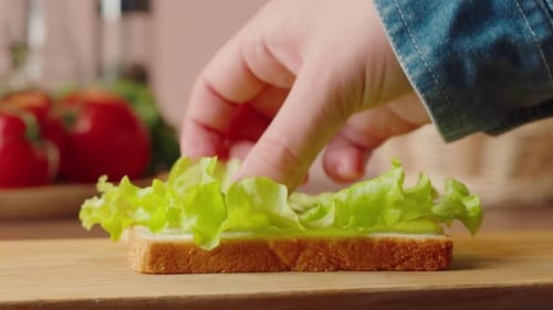 Preparing a Delicious Sandwich on Cutting Board