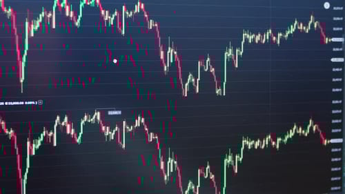 Stock Market Chart and Exchange Information with Price Data on the Market Wall
