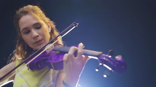 Woman Plays a Purple Violin