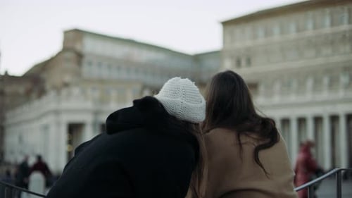Two Excited Italian Friends Looking Out at St Peter'S Basilica in St