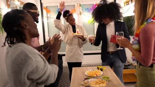 Friends Celebrate Birthday with Cake and Gifts