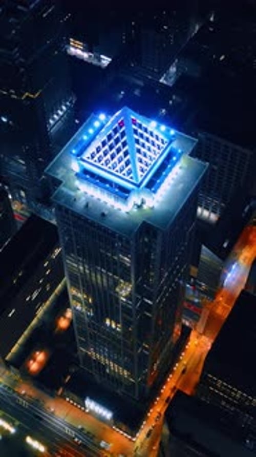 High tower building with the light top. Night city panorama from aerial perspective. Philadelphia