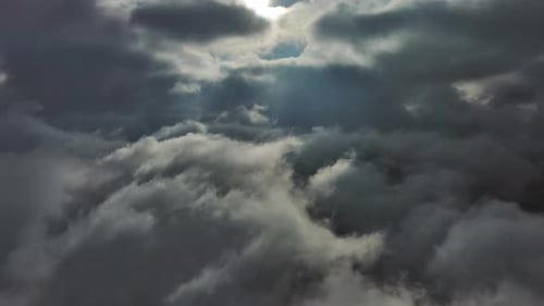 Aerial High View of Dramatic Clouds Flying