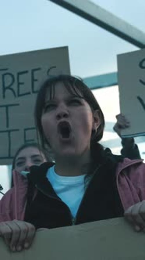 Woman Shouting About Climate Change With Protest Sign