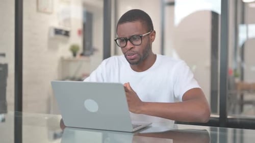 Young Adult Video Calling at Desk