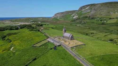 An old Irish christian church nestled in a quiet valley of Donegal, Ireland. A graveyard and car par