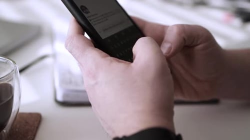 Man scrolling social media in smartphone