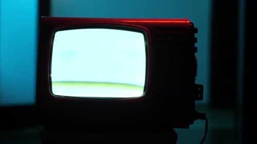 Vintage Red Television with Glowing Static Screen