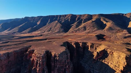 Dry desert with marvelous canyons and bare barren rocks.