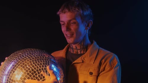 Young Adult Holding a Disco Ball