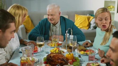 Family Celebrates Together With Food and Drink