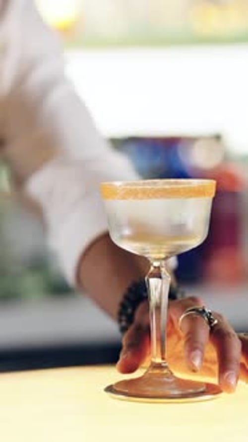 Bartender Making Cocktail with Ice for Bar Service