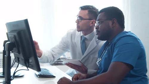 Doctor and Surgeon Talking Near Window Medical Workers in Hospital Office Day Light Healthcare
