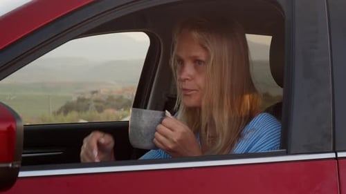 Woman Car Traveler Taking a Rest with Hot Tea