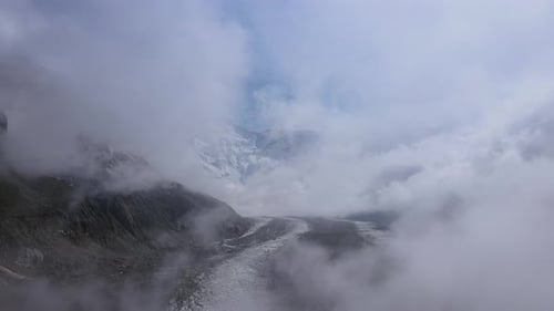 Mountains Fog Snowcovered Peaks Wild Terrain Aerial View Mountains Fog Embodying Wild Nature's