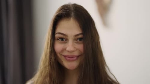 Happy Young Woman Smiling at Camera Close Up