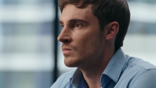 Contemplative Man Thinking in Office