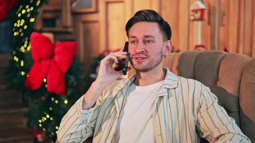 Man Relaxing in Armchair during Christmas Holiday