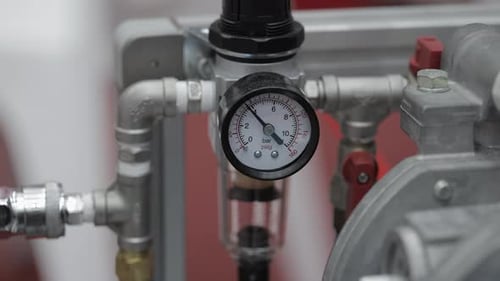 Pressure Gauge Displaying Measurement on Industrial Equipment in Workshop