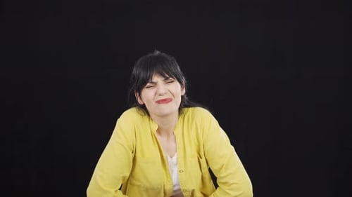 Woman experiencing stomachache.