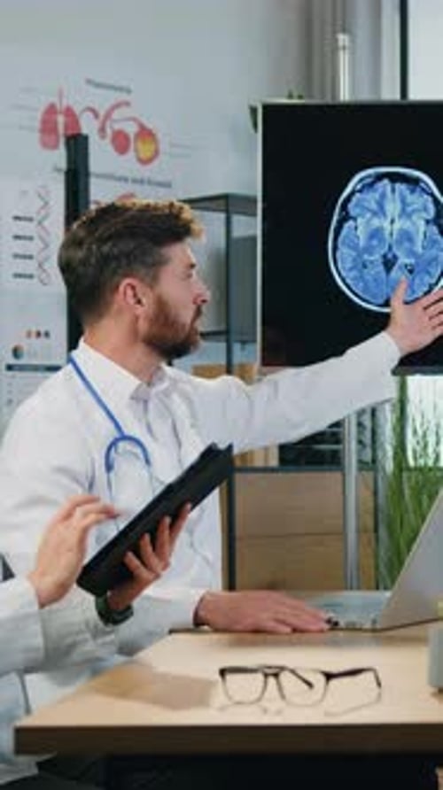 Doctors Discussing Brain Scan in a Medical Office