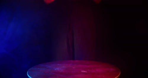 Hands Carefully Place Lit Skull onto Table