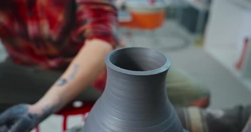 Man Potter Creating Big Ceramic Vase in Workshop on Pottery Wheel