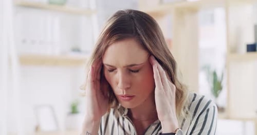 Woman Holding Temples in Office, Headache