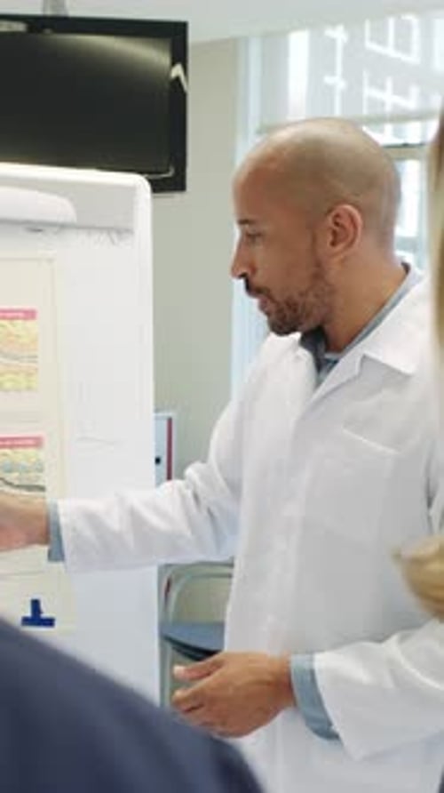 Medical Team Discussing Presentation in Hospital